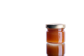 jar of jam on white isolated background with reflection