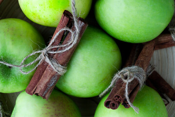 Apples with cinnamon. Green apples with cinnamon.