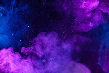 Shiny glitter particles in clouds of pink and blue neon colorful smoke abstract background - 500392629