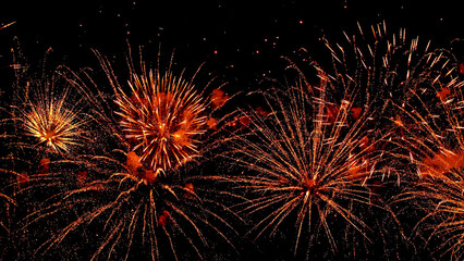 Fototapeta premium Festive grandiose fireworks festival against the background of the night sky. Multicolored motion blur splashes of fire . Pyrotechnics.