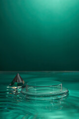 Front view of transparent podium and blank space in blue water background