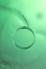 Top view of transparent podium and blank space in green water background