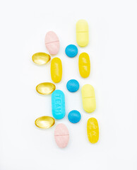 Different pills on color background, flat lay, top view