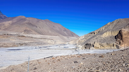 A view on a dry bottom of Himalayan valley. The valley is located in Mustang region, Annapurna...