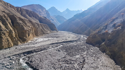 A small stream flowing in the dry bottom of Himalayan valley. The valley is located in Mustang...