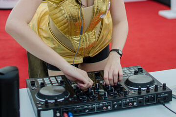 Dj mixing at party festival,Close up of DJ hands controlling a music table.