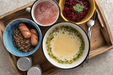 Complete healthy lunch with first and second course, salad and berry drink, top view. Food diversity concept