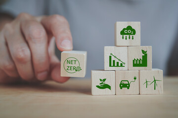 senior's hand holding net zero icon for health world ,CSR, eco green sustainable living, zero...