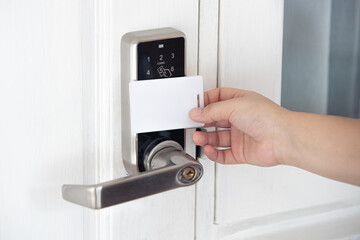 closeup people using contactless ID card scan door locker security system opening the door