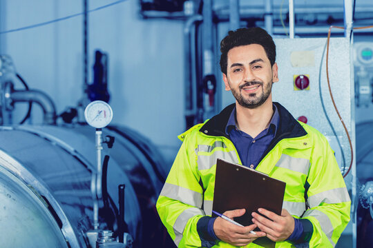 Portrait Hispanic Latin smart engineer worker happy smile working in factory