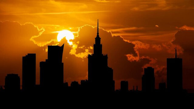 Warsaw Downtown Skyline at Sunset,Time Lapse with Red Skys and Fiery Sun, Poland