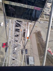 Iron Ferris wheel structure with a view from the cabin