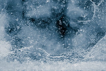Ice texture background. Textured, dark blue-toned, the cold, cracked, frosty surface of an ice block. - 500407229
