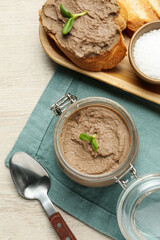 Flat lay composition with delicious liver pate on white wooden table