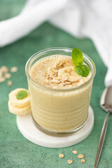 banana smoothie with oatmeal and cinnamon in a glass