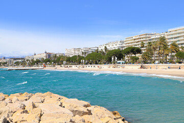 The beach, beach promenade and the town Cannes - France