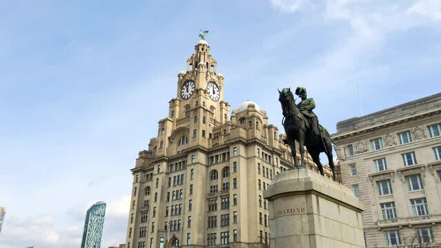 Liverpool, UK, April 16th 2022: Liverpool Liver building. The Royal Liver Building is a Grade I listed building in Liverpool, Merseyside. Located at the Pier Head waterfront. Statue of Edward VII.