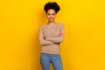 Photo of nice millennial brunette lady crossed arms wear beige sweater isolated on yellow color background