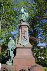 Lier, Belgium - April 9. 2022: Closeup of bronze bust of writer and flemish activist Tony Anton Bergmann on large stone pedestal in park