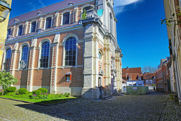 Lier (Begijnhof), Belgium - April 9. 2022: View on old church in medieval unesco world heritage site village on sunny day
