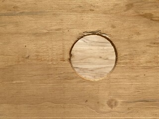 a round hole in a plywood panel