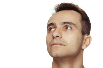 Obraz premium Close-up portrait of young handsome man with clean face, perfect skin, shirtless posing isolated over white studio background