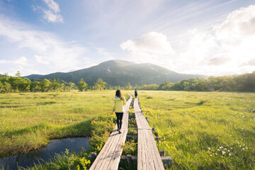 Hiker on a Wooden Walkway in Oze National Park, Gunma, Japan