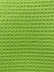 a light green surface with a uniform pattern