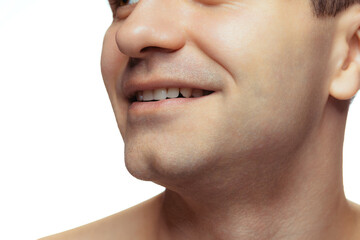 Obraz premium Cropped image of male white perfect teeth, mouth isolated over white studio background