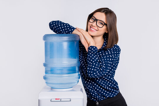 Portrait of attractive cheerful brown-haired girl bonding cooler pure water order delivery isolated over grey pastel color background