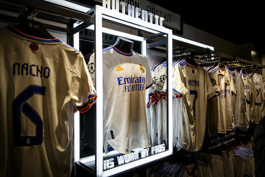 Real Madrid kit in the fan shop. Club store with team shirts.