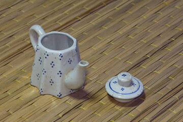 still life classic ceramic kettle on mat