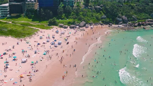 Freshwater Beach, Sydney with crowds of swimmers during summer 