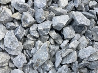 heaped up light gray ballast stones