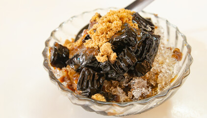 Grass jelly on a white table, soft focus image.