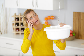 woman calling to plumber for water leakage problem