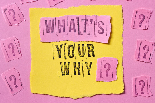 What's Your Why text on torn edge paper with many question marks. Meaningful life concept.
