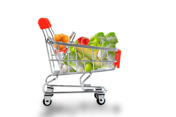 Close-up Shopping cart or shopping trolley with vegetable and fruits isolated on white background, with clipping path selection. Shopping concept.