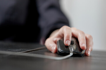 close up of businesswoman using computer mouse
