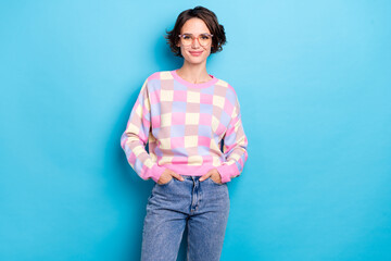Photo of nice young brunette lady wear spectacles plaid sweater jeans isolated on blue background