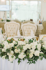 Stylish decorated wedding tables with flowers