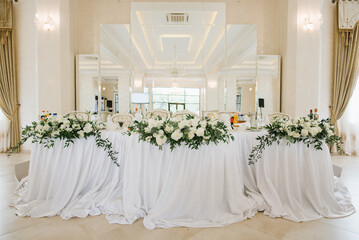 Stylish decorated wedding tables with flowers