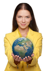 Happy smiling woman holding small earth globe on her palm