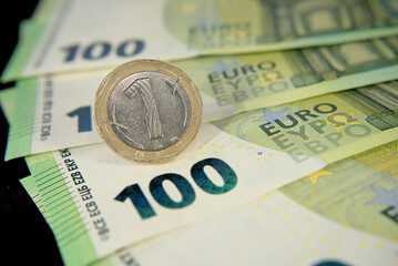 Obraz na płótnie Canvas one hundred euro banknotes of the European Union, one Bulgarian lev macro photo