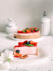 Yogurt cake with strawberries, blueberries and mint.