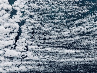 snow and frost on a pane of glass