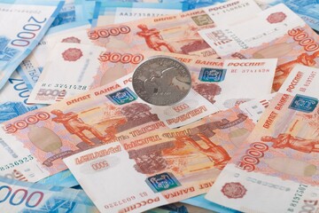 One US Dollar on Russian ruble. Money background. Currency exhange. Economic crisis. Rouble dollar cash. Hundred dollar bill and 5000 rubles. Business and finance. Russia and USA