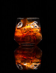 old fashioned cocktail on black background and reflection.