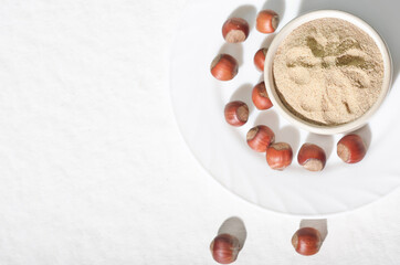 Bowl with hazelnut flour on table, top view. gluten free low carbohydrate diet