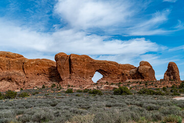 Arches National Park at Midday - Arches has many arches including the famous Delicate Arch, the Window Arch, the Double Arch and other features such as Tower of Babel, Turret Arch, and the Courthouse  © RebeccaDunnLevert